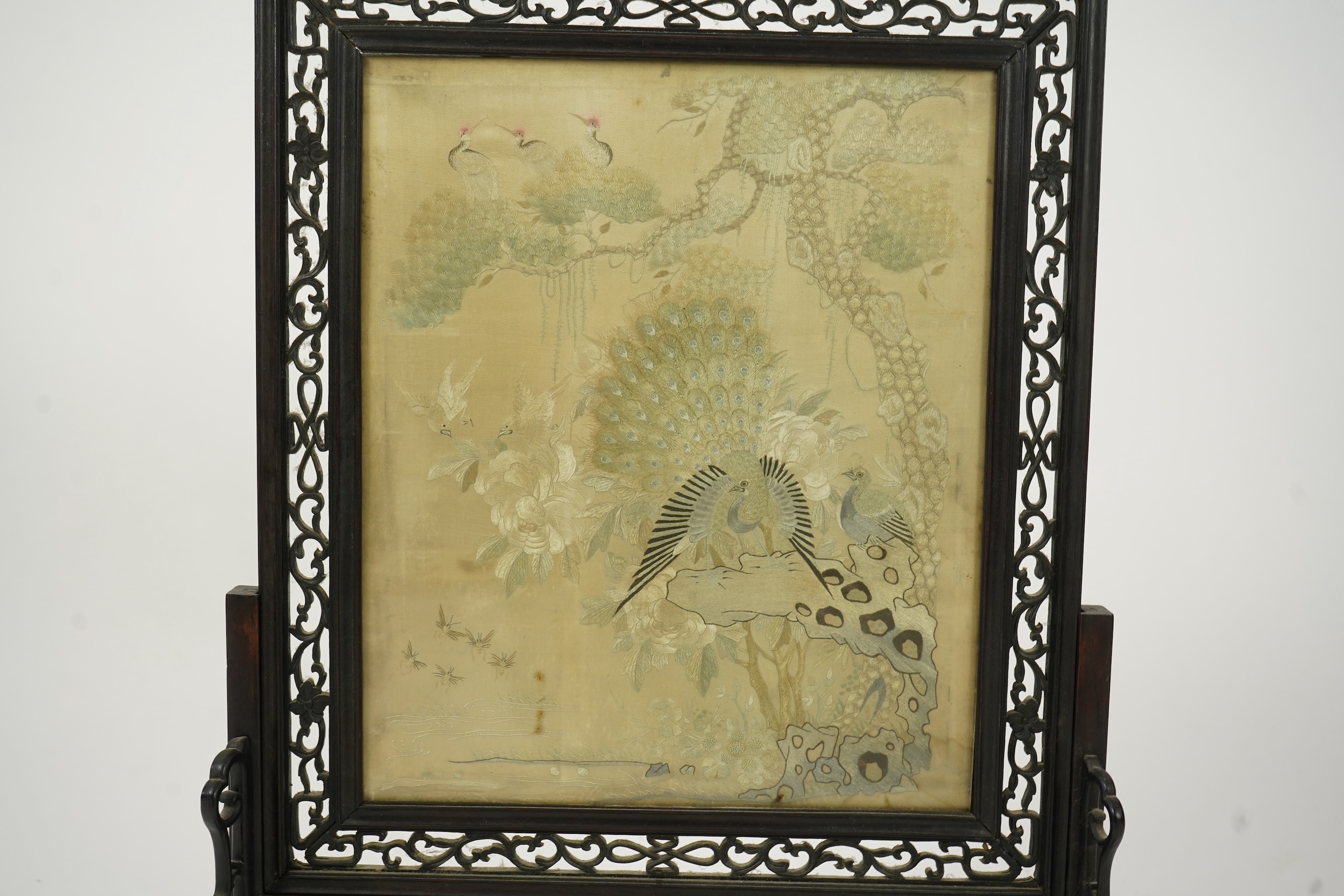 A Chinese ’Hundred bird’ embroidered silk table screen and hongmu stand, late 19th/early 20th century